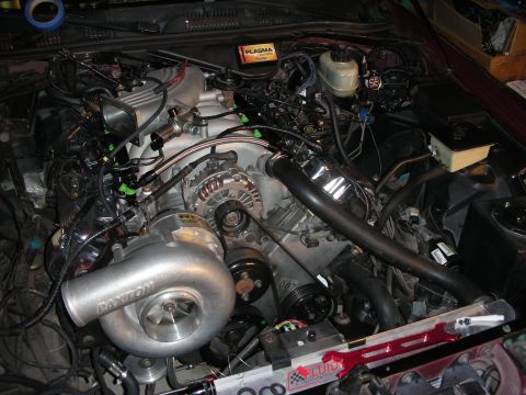1992 Ford Crown Victoria - The engine bay shows a custom turbocharger setup with prominent Paxton branding on the turbo unit.