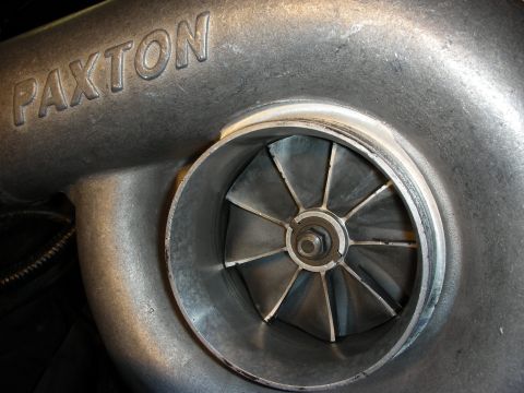1992 Ford Crown Victoria - A Paxton supercharger is shown in detail, highlighting its internal components and branding.