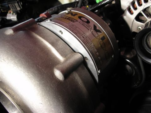 1992 Ford Crown Victoria - A Novi supercharger is shown with its identification tag, detailing its serial number and warranty terms.