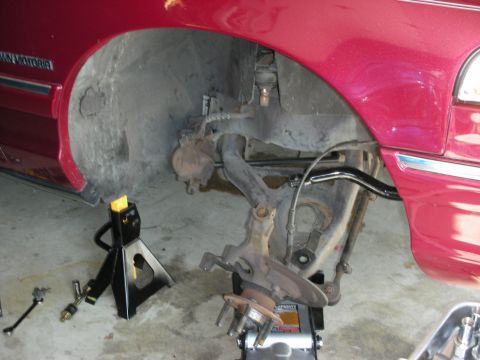 1992 Ford Crown Victoria - Front suspension of a 1992 Ford Crown Victoria undergoing repairs.