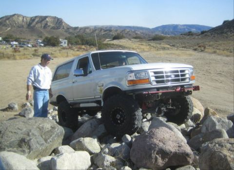 1996 Ford Bronco - A silver 1996 Ford Bronco navigates a rocky trail in Hungry Valley, California.