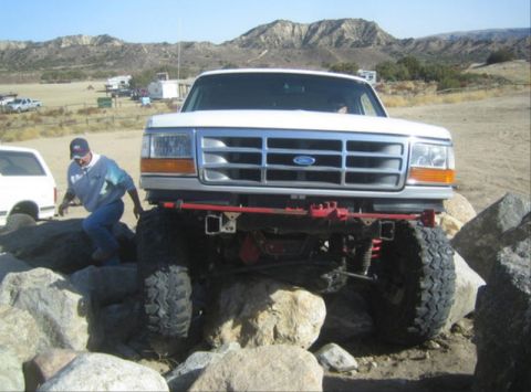 1996 Ford Bronco - This 1996 Ford Bronco is shown off-roading over large rocks.
