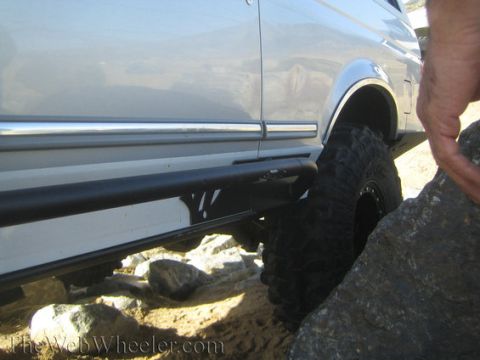 1996 Ford Bronco - A 1996 Ford Bronco navigates rocky terrain, its off-road capabilities.