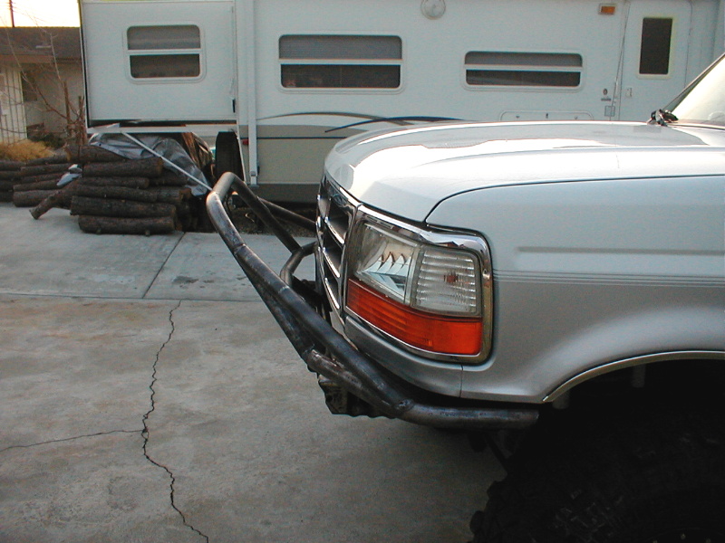 Silver 1996 Ford Bronco front bumper with custom brush guard