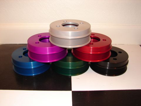 1992 Ford Taurus - Several colorful pulleys are stacked together, with a watermark for SuperMotors at the bottom right.
