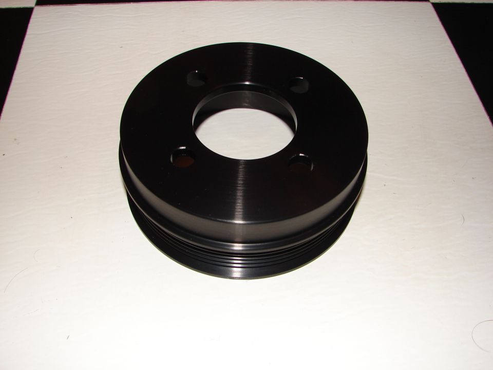 Black metal crankshaft pulley with multiple grooves for belts
