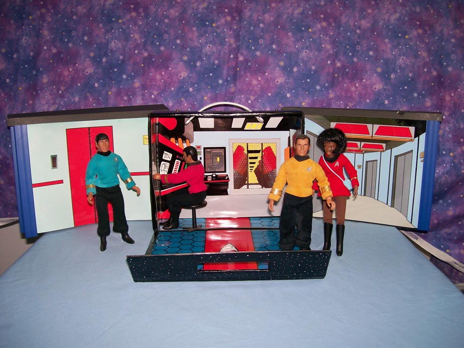 Star Trek action figures in a playset with a starry background