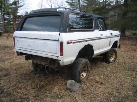 1979 Ford Bronco - This 1979 Ford Bronco is shown from a 3/4 front angle, a black hardtop and off-road tires.