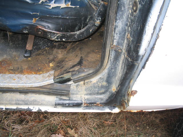 Interior door frame and torn seat of a vehicle