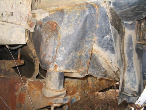 1979 Ford Bronco - The frame and suspension of a 1979 Ford Bronco show significant rust damage.