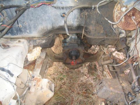 1979 Ford Bronco - View of the engine bay, showing the transmission and various wires.