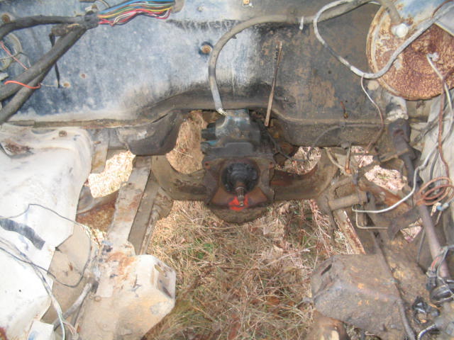 Engine bay with transmission and wiring