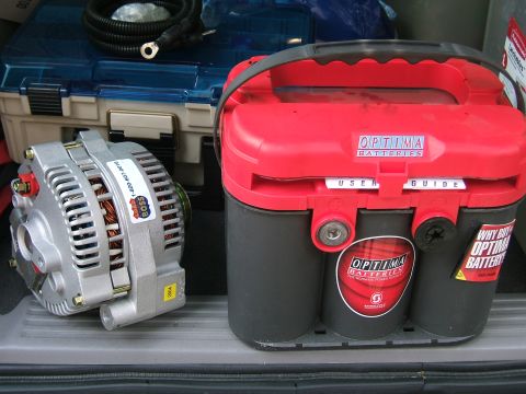 1991 Ford Bronco - An alternator and an Optima battery are shown together, possibly for sale or installation.