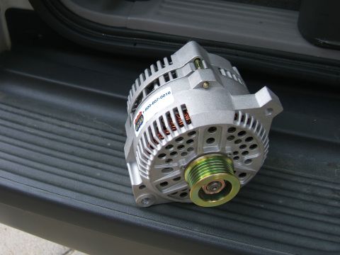 1991 Ford Bronco - A close-up view of a car alternator, a crucial component for the vehicle's electrical system.