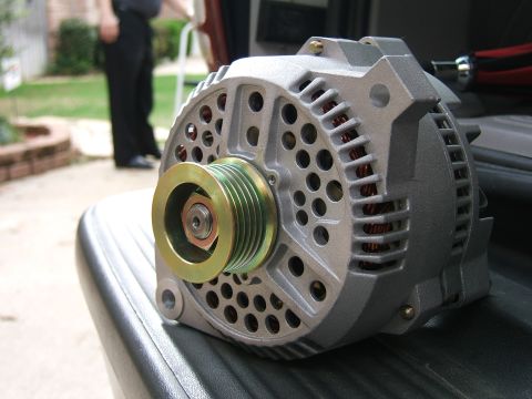 1991 Ford Bronco - Close-up of an automotive alternator, a key component for vehicle electrical systems.