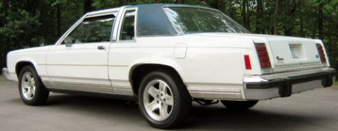 1985 Ford LTD Crown Victoria - This two-door sedan features a chrome bumper and aftermarket wheels.