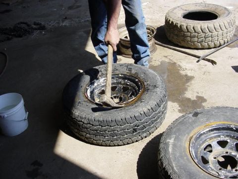 1992 Ford Bronco - break both beads by hitting with a mallet in one spot them moving side to side from that spot about 5 inches till the bead rolls off. some…