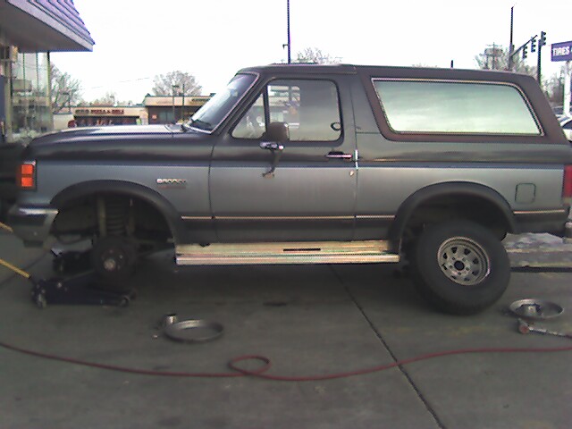 Bye, bye old tires!  One of the new ones are on the back here.  Since I haven't done a lift or anything, these are my temporary tires for daily driving.  Once a lift goes on (need a stepladder to get in) then the offroad puppies are going on!