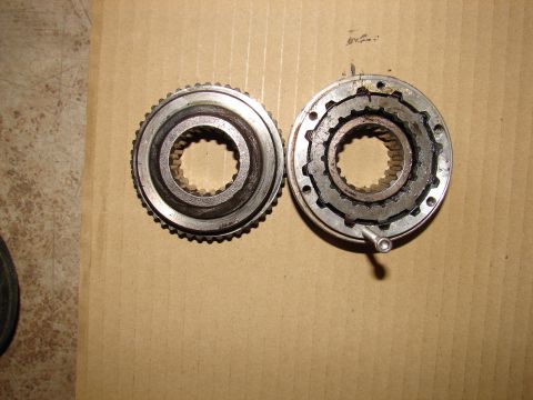 1996 Ford Bronco - Two components of a vehicle hub assembly are shown, one disassembled and one intact.