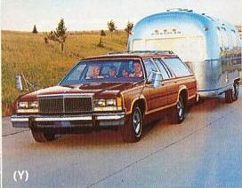 1982 Ford Crown Victoria LTD - This Ford station wagon is towing a classic Airstream trailer on a sunny day.