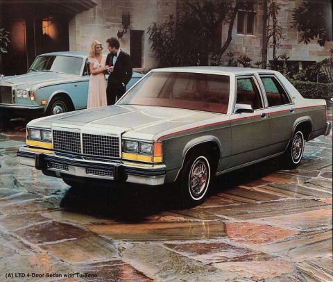 1982 Ford Crown Victoria LTD - A couple stands near a light blue Rolls-Royce as a Ford LTD sedan is parked in front of a large house.