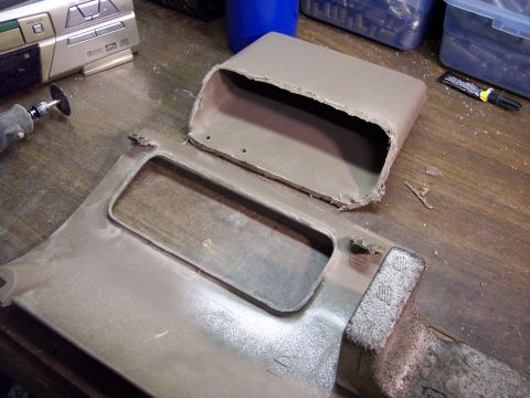 1996 Ford Bronco - First, I cut off the cubby hole pocket using my trusty Dremel tool. And yes, those are boxes of fired pistol cartridge cases on my bench (I…