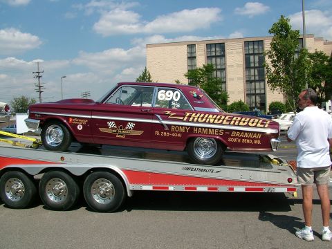 1972 Ford Ranchero - A custom maroon drag car, identified as 'Thunderbolt', is loaded onto a trailer.
