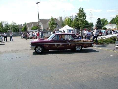 1972 Ford Ranchero - A customized 1962 Ford Falcon, known as 'Thunderbolt', is parked outside with other vehicles and people.