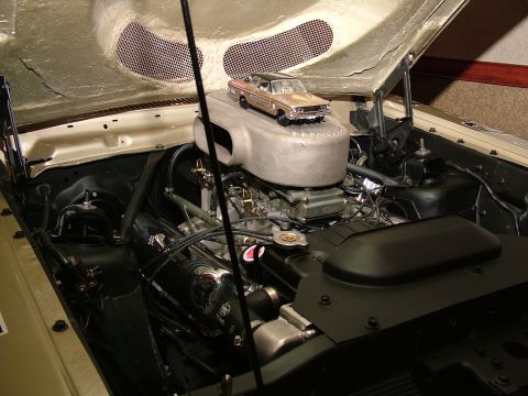 1972 Ford Ranchero - A model of a car sits atop the air cleaner assembly in an open engine bay.
