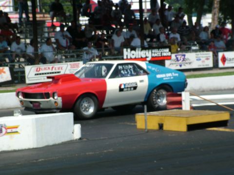 1972 Ford Ranchero - AMC Javelin drag car with distinctive red, white, and blue paint scheme on the track.
