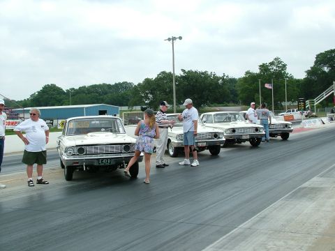 1972 Ford Ranchero - Cars are lined up on a drag strip, possibly for a race or car show.