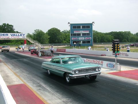 1972 Ford Ranchero - A teal 1964 Ford Galaxie 500 is on the drag strip at Thunder Valley Raceway Park.