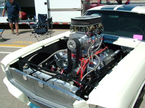 1972 Ford Ranchero - Customized 1970s muscle car engine bay with a prominent supercharger and chrome details.