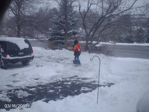 1996 Ford Probe - A black Jeep Grand Cherokee sits in a snow-covered driveway on a winter day.