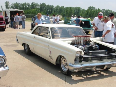 1972 Ford Ranchero - A modified 1965 Ford Falcon Ranchero drag car is displayed with its hood open, revealing a powerful engine.