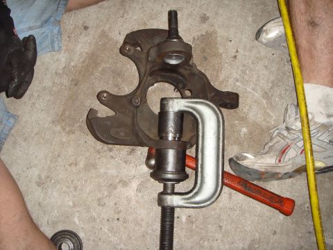 1992 Ford Bronco - Here's how to set up and press in the lower joint. Don't forget to install the new snapring.