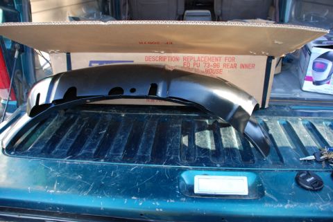 1996 Ford Bronco - New inner fender part for a 1973-1996 Ford pickup truck, shown in its box.