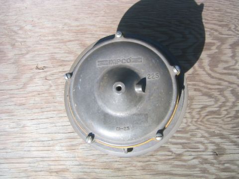 1973 Ford F-100 - This is an Impco 225 part, marked 'CI-25', shown on a wooden surface.