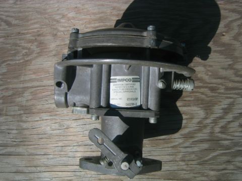 1973 Ford F-100 - IMPCO carburetor, part number CA225B-2, dated 07/03/87, shown on a wooden surface.
