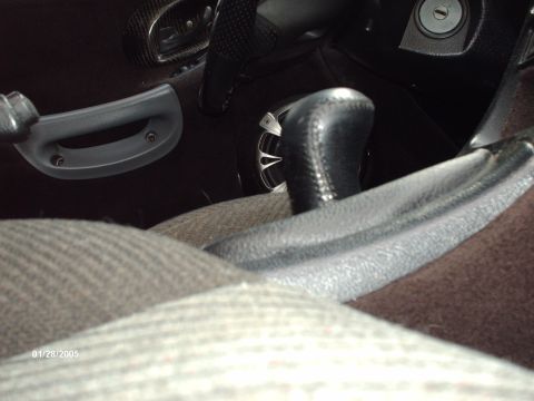 1995 Ford Probe - Interior shot of a car, the gear shift and door handle. Date stamp visible: 01/28/2005.