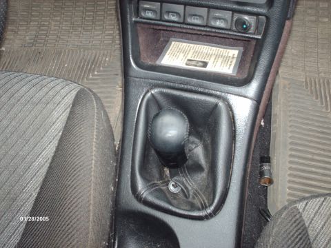 1995 Ford Probe - Close-up of a car's center console and driver's seat, with a date stamp of 01/28/2005.