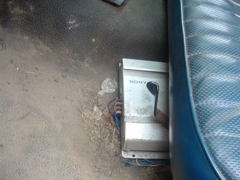 1983 Ford Ranger - Car amplifier with visible wiring is mounted on the floor beneath the vehicle's seat.