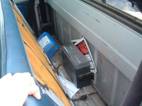1983 Ford Ranger - The interior of a truck bed contains a blue jug, a Sony device, and "FOR SALE" signs, suggesting items for sale or storage.