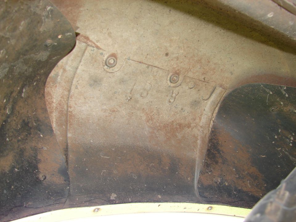Inner fender with stamped numbers '13 8'