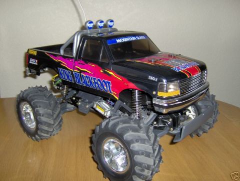 1988 Ford Bronco - This remote control truck features oversized tires and custom graphics, resembling a modified pickup.