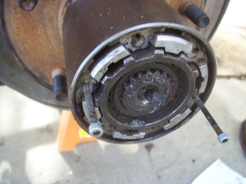 1994 Ford Bronco - Close-up view of a Warn Premium manual locking hub, likely for a 4x4 vehicle.