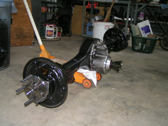 Rear axle assembly on an orange jack