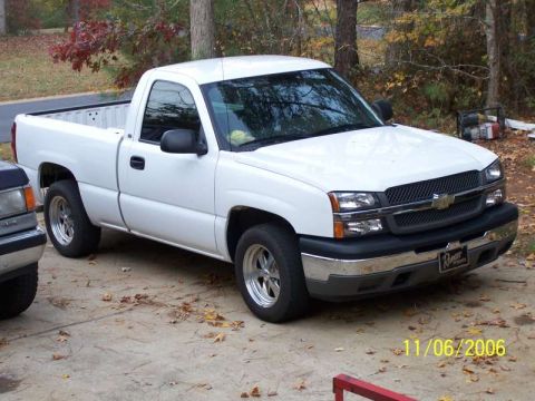 1979 Ford F-150 - A white pickup truck is parked on a concrete driveway with fallen leaves scattered around. A date stamp shows 11/06/2006.