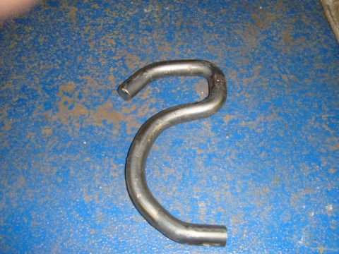 1996 Ford Bronco - A bent metal pipe, possibly an exhaust component, is shown against a blue background.