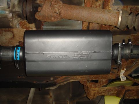 1996 Ford Bronco - Close-up of a Flowmaster exhaust muffler, showing patent information and manufacturing location.